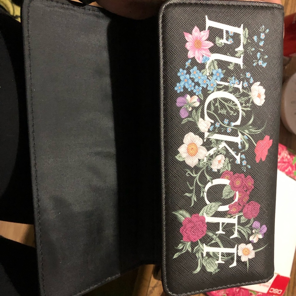 Leather Wallet that says “Fuck Off”.